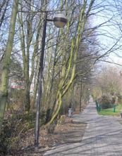 A path in Monheim's Bürgerpark with globe lights on the left side