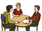 Leichte Sprache Bild: mehrere Personen an einem Tisch, eine Frau rechts spricht